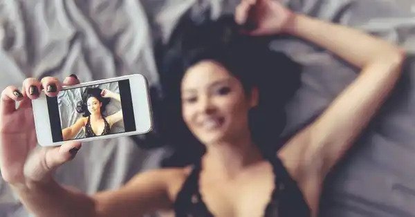 asian girl taking selfie from above